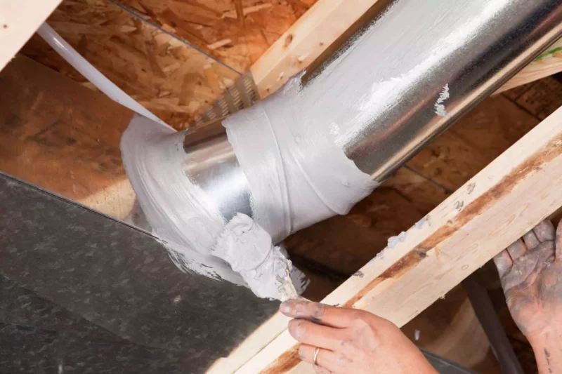 Tech-applying-mastic-sealant