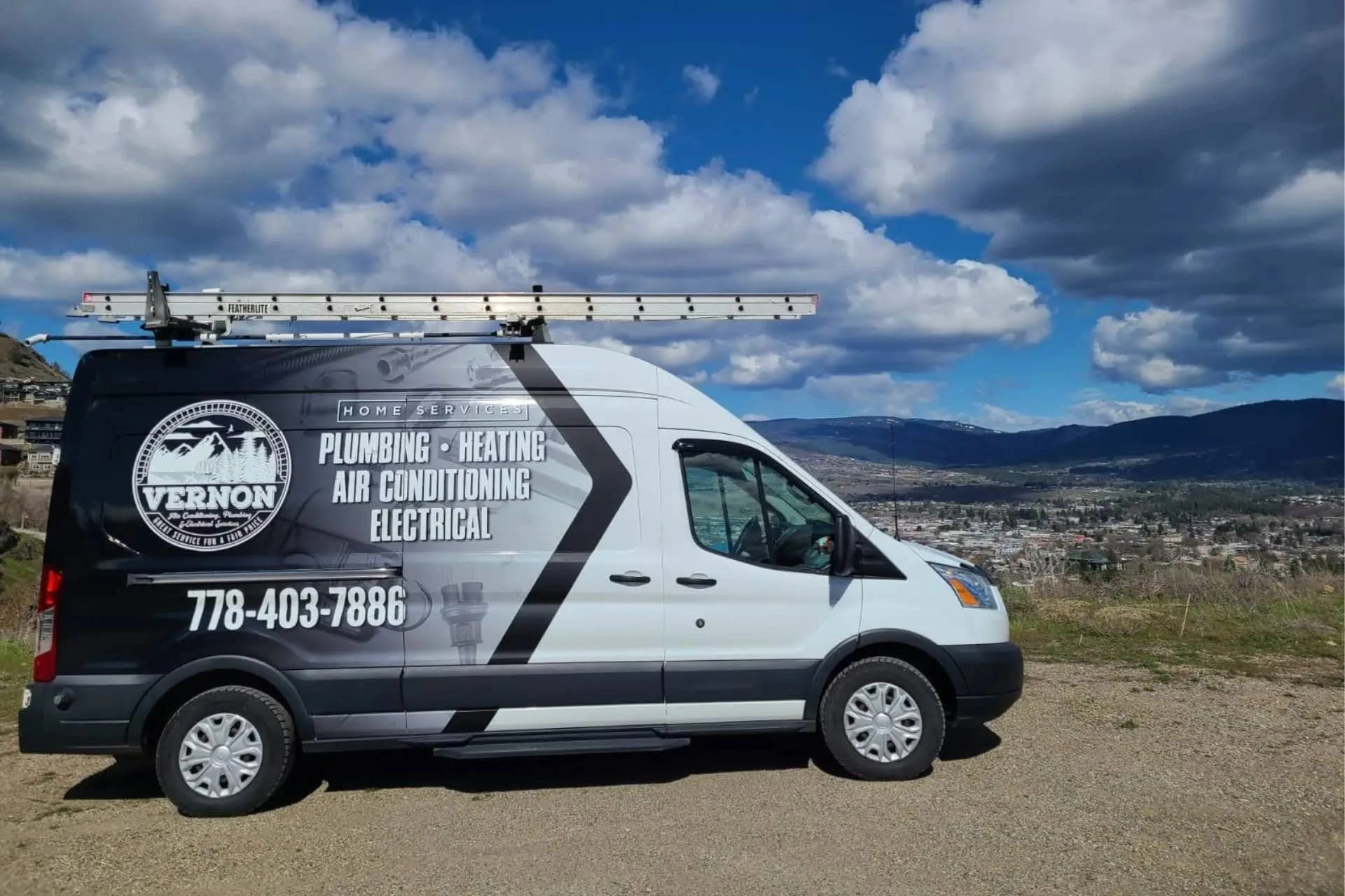 Vernon AC Plumbing and Electrical Services van parked in silver star foothills