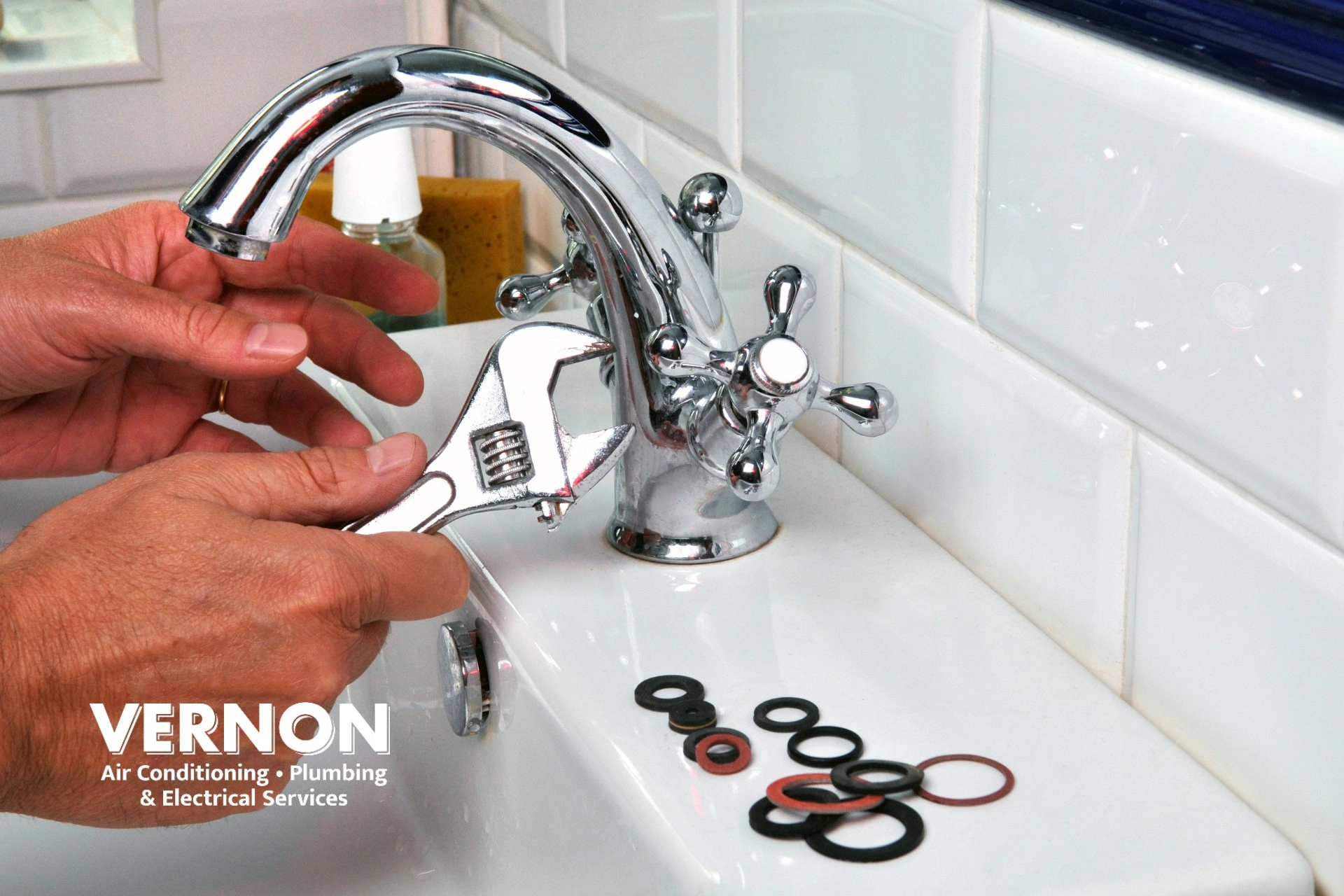 homeowner repairing a leaking faucet