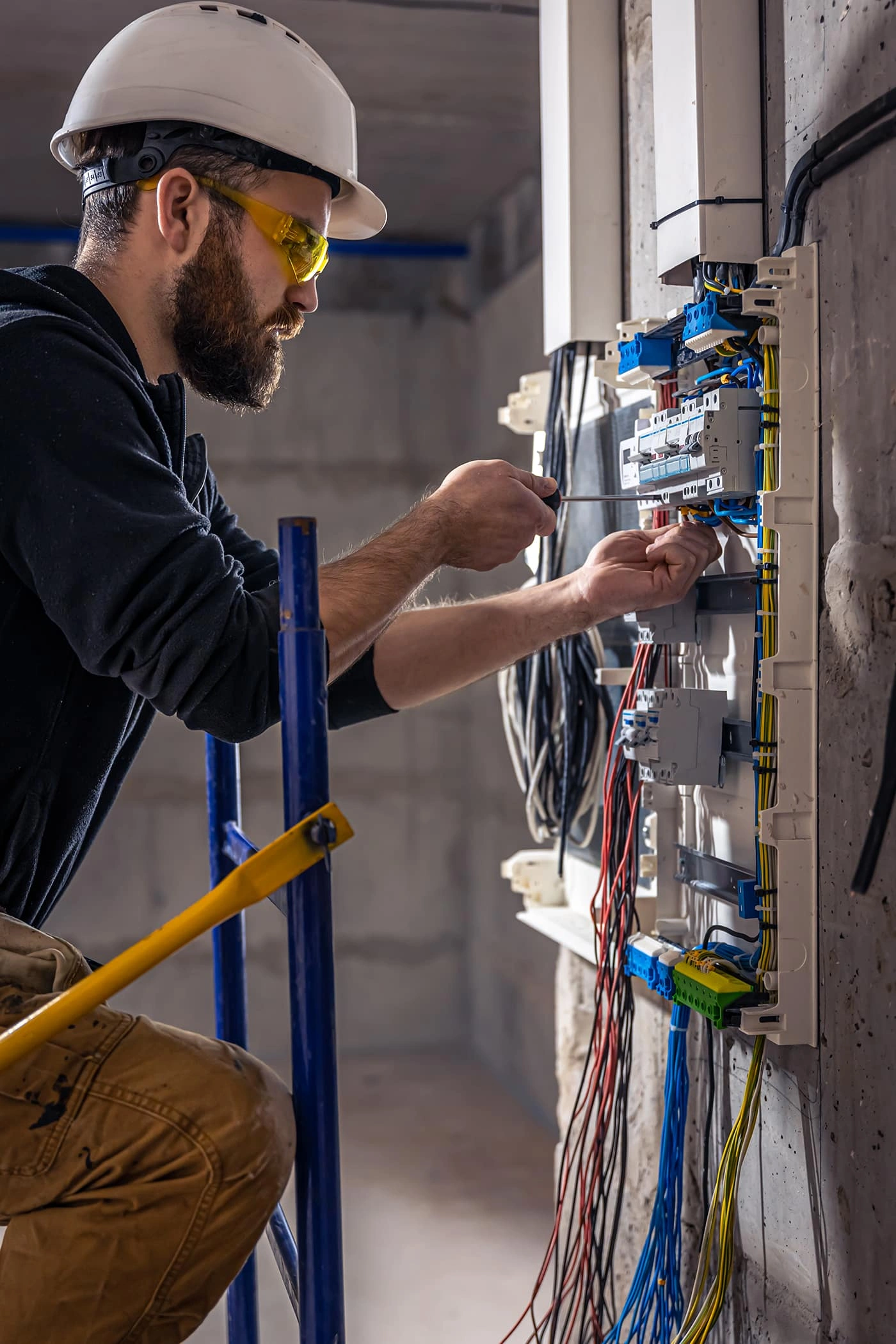 Vernon AC Electrician working on an electrical panel