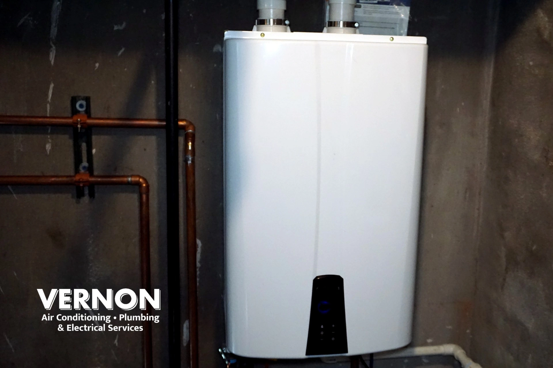 tankless water heater mounted in utility room